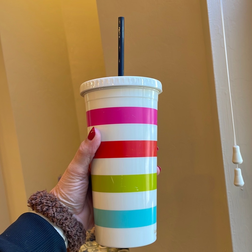 Kate spade shatterproof cup with straw.    Holds approx 16 oz.